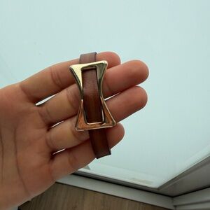 Leather bracelet with a gold-tone buckle